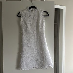 J. Crew white, high collar mini dress with floral detailing.